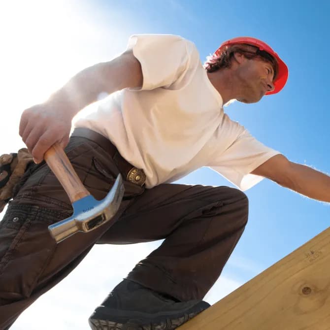 roofing professional climbing in the roof